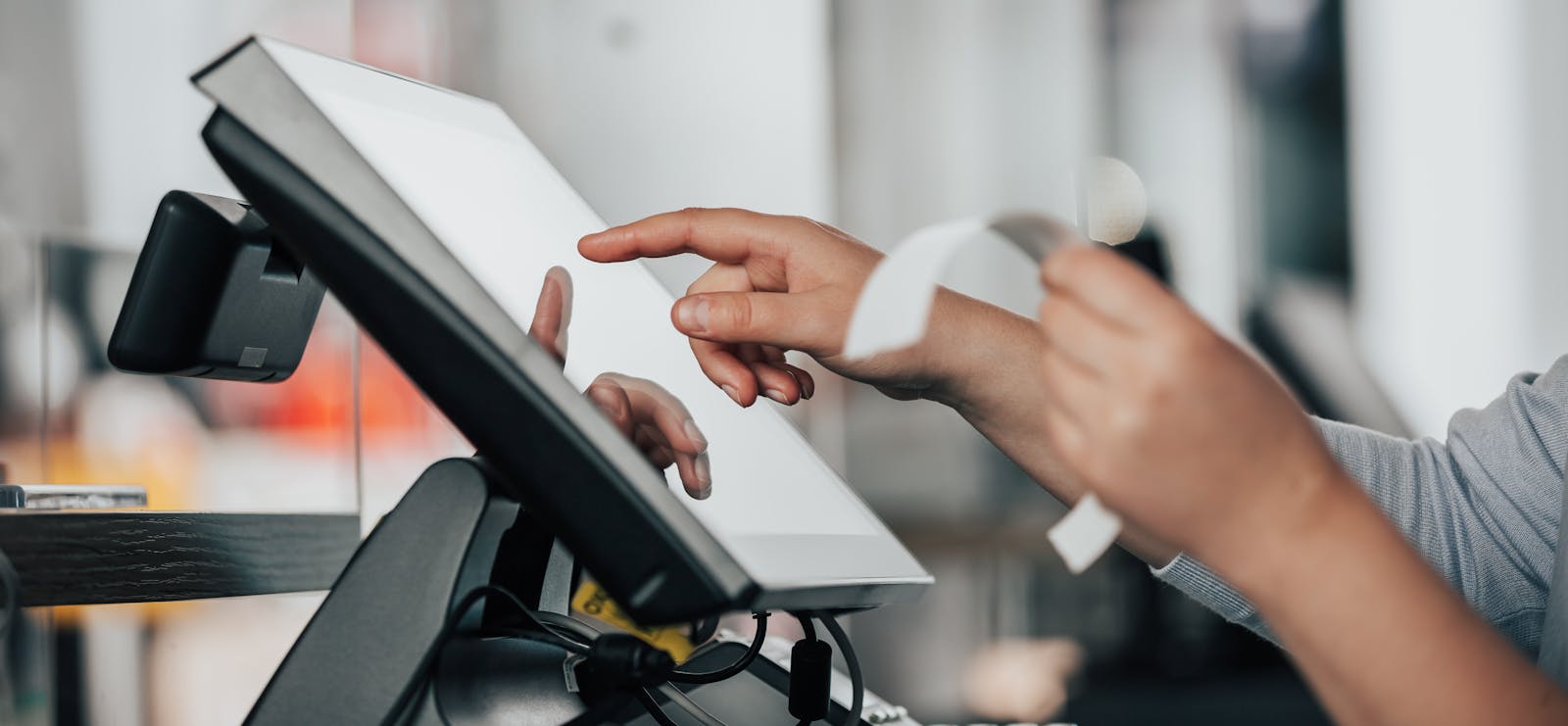 A restaurant owner using a POS system.