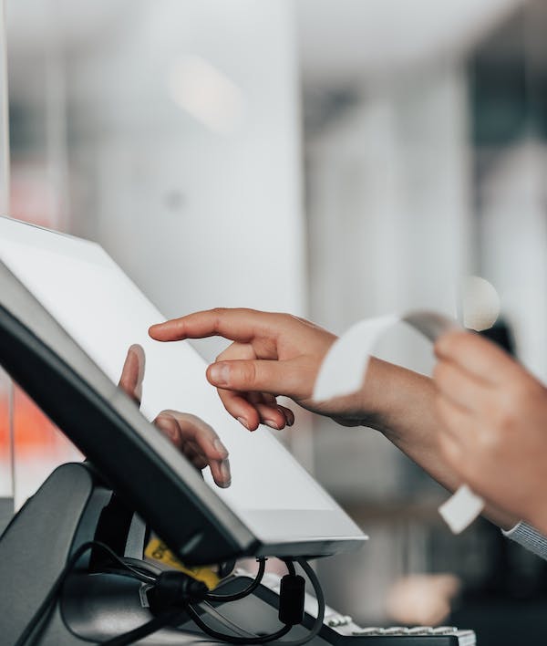 A restaurant owner using a POS system. 