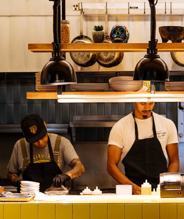 Kitchen staff working at a restaurant. 